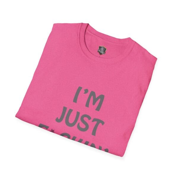 Pink folded t-shirt with prominent gray text saying "I'M NUTS" visible, laid on a white background.