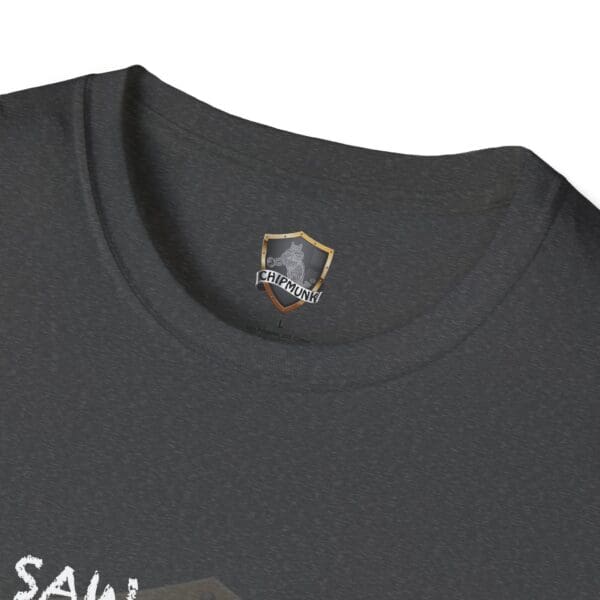 Close-up of a dark gray "I Saw T-Shirt" featuring a small shield logo with the word "Chipmunk" beneath the collar.