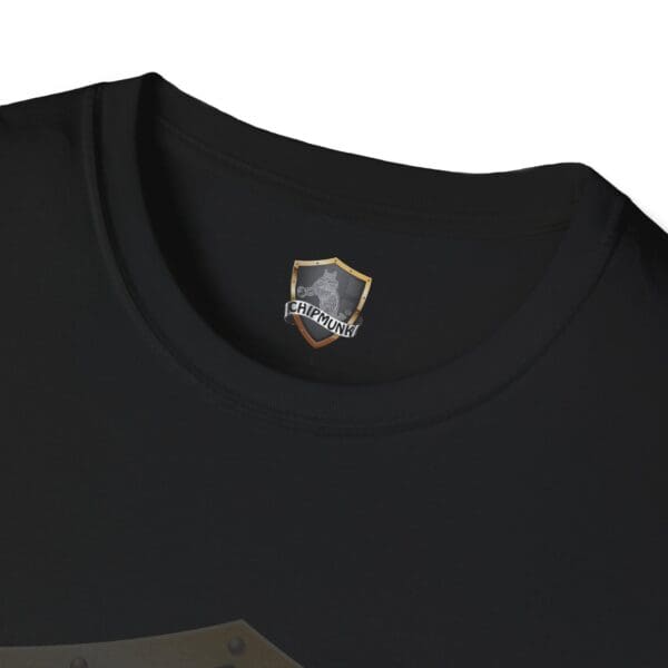 Close-up of the collar of a black Hear The Stupid T-Shirt, featuring a "Chipmunk" logo with a shield and chipmunk graphic printed on the inside.