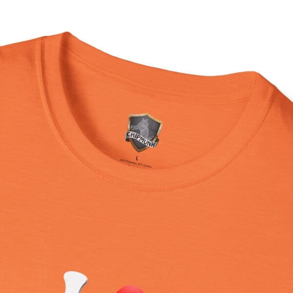 Close-up of an orange "I Love Hot Taco T-Shirt" featuring a "Chipmunk" label inside the collar, indicating size L and a fabric composition of 65% polyester and 35% cotton.