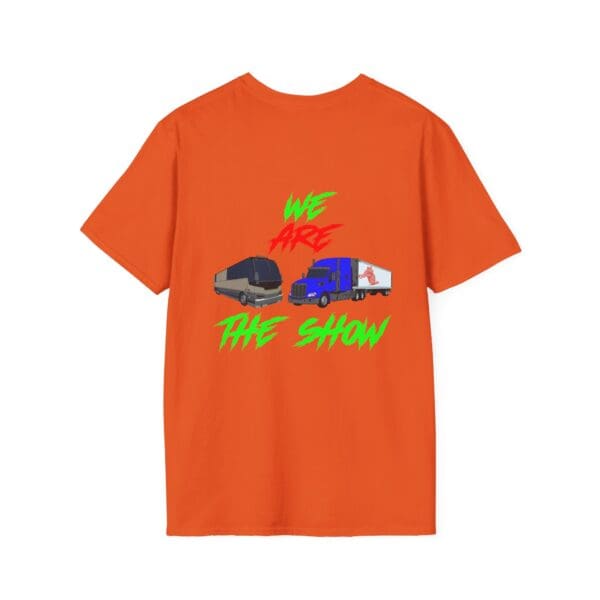 The Show T-Shirt is bright orange with the phrase "WE ARE THE SHOW" in vibrant green and red, and it showcases two illustrated vehicles—one in black and one in blue—on the back.