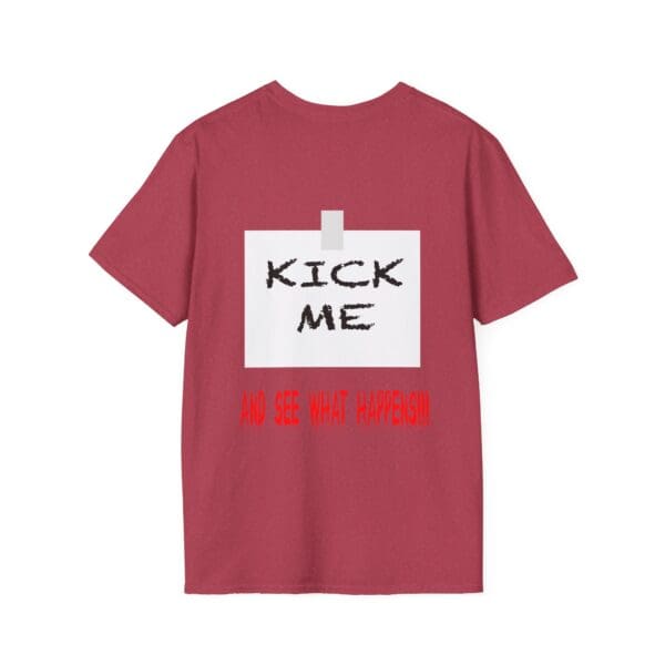 The Kick Me T-Shirt features a red design, with the bold text "KICK ME" in large black letters on a white square, accompanied by the phrase "AND SEE WHAT HAPPENS!" in smaller red letters below.