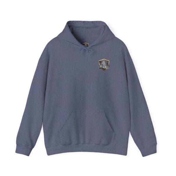 The Show Hoodie in blue, with a small shield logo on the left chest featuring a mountain design.