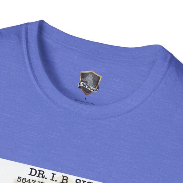 Close-up of a blue Laughter T-Shirt collar featuring a "Chipmunk" logo, with the text "Dr. I.B. Sign" and an address printed underneath on the fabric.