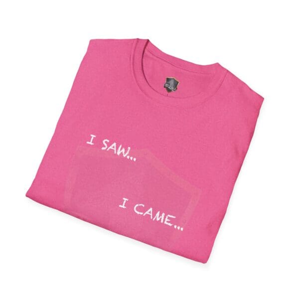 A folded I Saw T-shirt in pink, featuring the text "I SAW... I CAME..." in bold white capital letters.