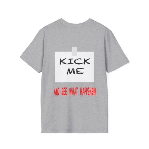 Kick Me T-Shirt in gray featuring a design with a taped white paper on the back that displays "KICK ME" in black and "AND SEE WHAT HAPPENS!!!" in red.