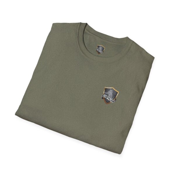 Kick Me T-Shirt in folded olive green, featuring a small shield emblem on the front.