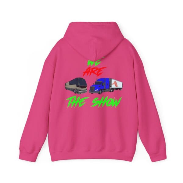 The Show Hoodie in pink, showcasing images of a tour bus and a truck on the back, adorned with vibrant text saying "WE ARE THE SHOW.