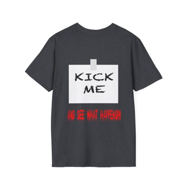 The Kick Me T-Shirt features a black design with a taped white square on the back that reads "KICK ME" in bold black letters and "AND SEE WHAT HAPPENS!!!" in red beneath it.