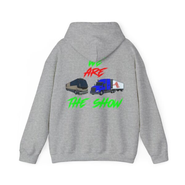 The Show Hoodie is a gray sweatshirt adorned with illustrations of a tour bus and a truck, accompanied by the bold text "WE ARE THE SHOW" in red and green.