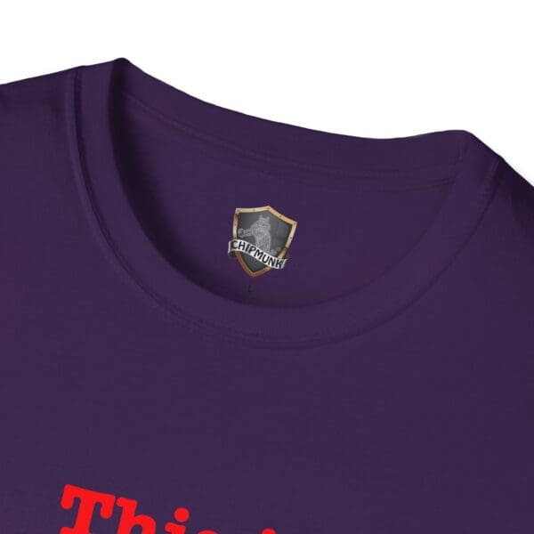 Close-up of a purple "This is Your Brain on Hugs" T-shirt featuring a small crest and the word "Chipmunk" on the collar label, with red text displayed on the front.