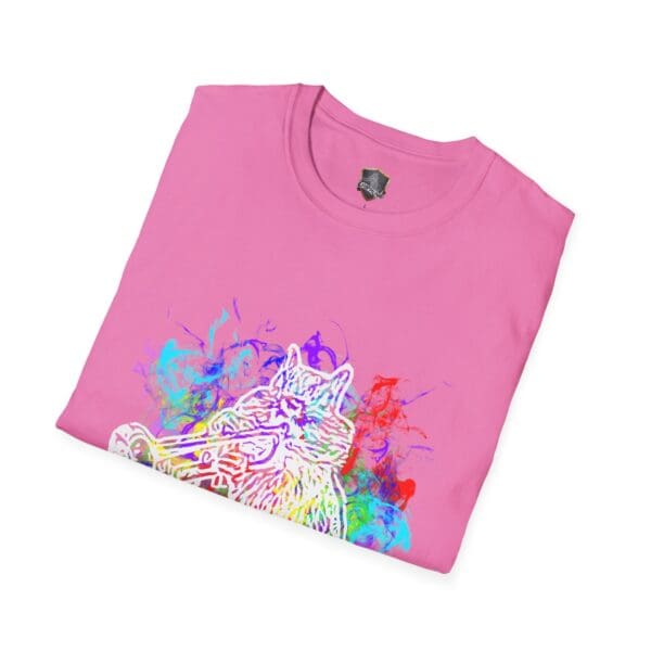 The Smoked Chipmunk T-Shirt, a folded pink tee, showcases an artistic design of a cat playing a trumpet amid vibrant abstract splashes.