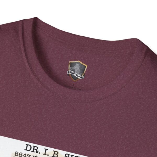 Close-up of the Laughter T-Shirt in maroon, showcasing a rectangular label on the front displaying the text "Dr. I.B. Sican." Inside the neckline, there's a visible logo featuring the word "Chipmunk.