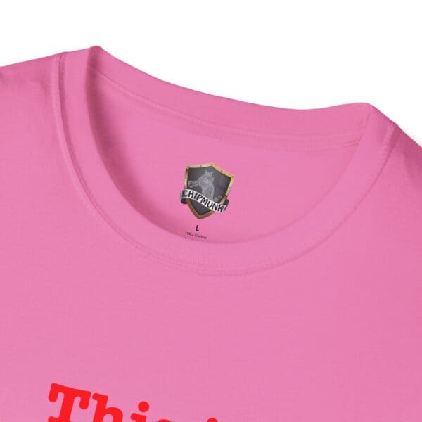 Close-up of a pink t-shirt with a visible neck tag labeled "This is Your Brain on Hugs" and "100% Cotton.