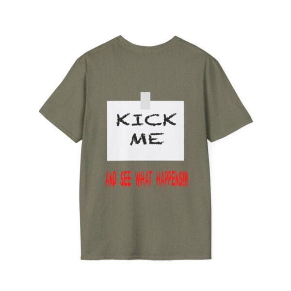 Kick Me T-Shirt featuring a "Kick Me" note taped on it and the bold red text "AND SEE WHAT HAPPENS!!!