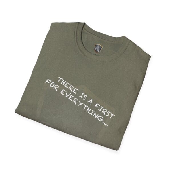 A folded green T-shirt with the phrase "There's a First for Everything... Except Impressions!" printed on it in white.