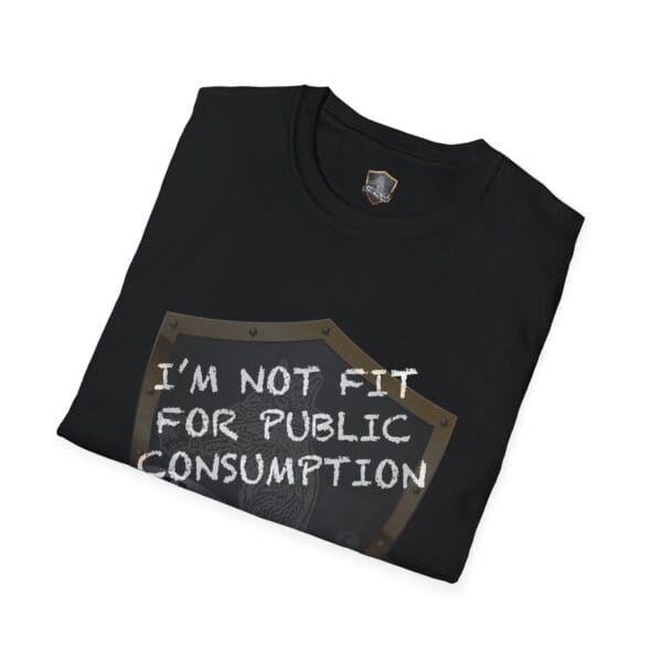 Folded black t-shirt featuring a shield graphic and the text "'I'm Not Fit for Public Consumption' Shirt" in white letters.