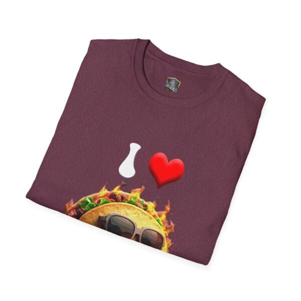 Folded maroon t-shirt featuring the "I Love Hot Taco" design, which includes a graphic of a taco wearing sunglasses, set against a flaming background, with the text "I ❤️".