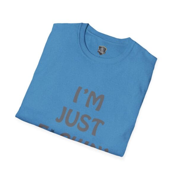 Folded blue "I'm Nuts" t-shirt with partial text, "I'M JUST F..." visible.