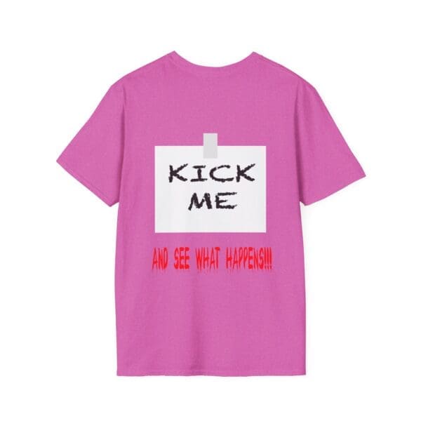 Kick Me T-Shirt in pink featuring a taped note graphic on the back that reads "KICK ME" in black and "AND SEE WHAT HAPPENS!!!" in red.