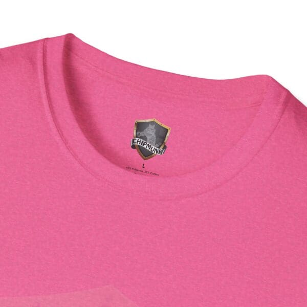 Close-up of a pink "Hear The Stupid" T-shirt with a Chipmunks label inside the collar area.