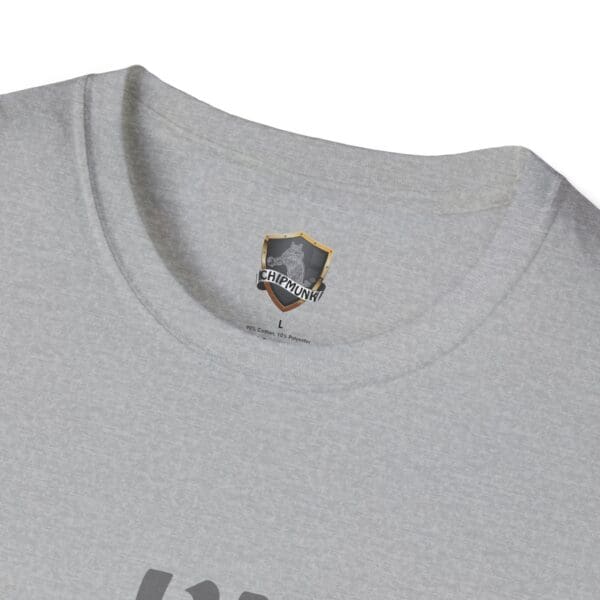 Close-up of the "I'm Nuts" T-shirt in gray, highlighting the neck area with a label inside featuring a shield logo and the word "CHIPMUNK." The fabric looks soft and lightweight.