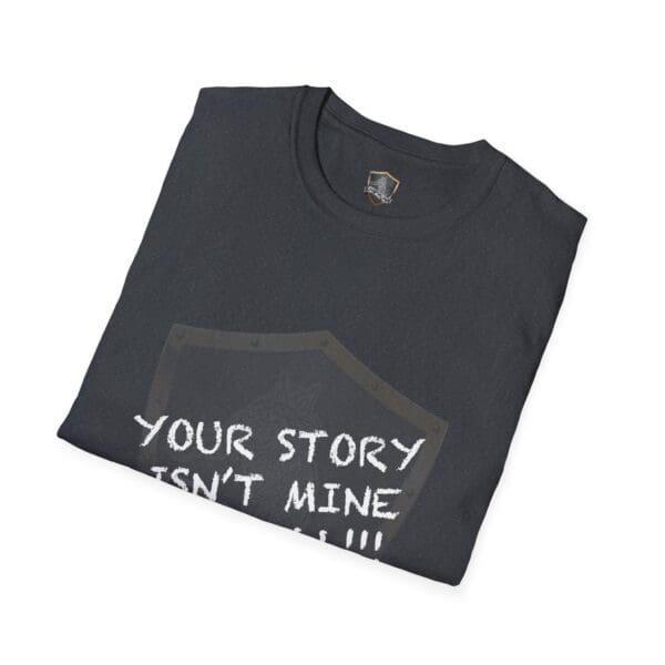 A folded black "Your Story Is Not Mine to Tell" t-shirt featuring a shield design with partially visible text.