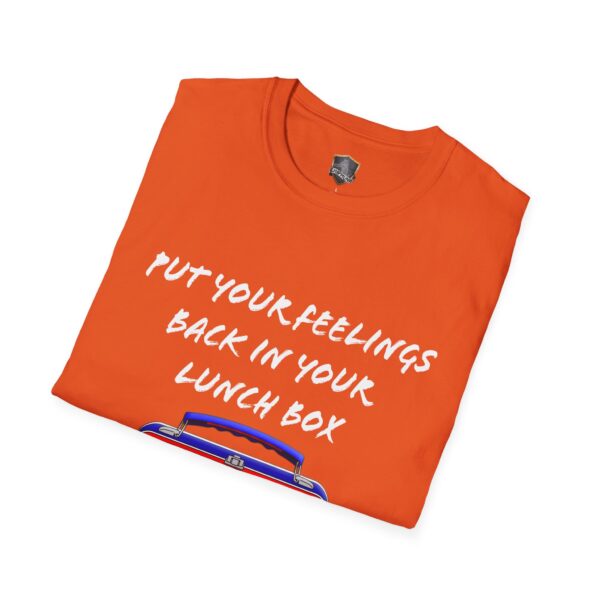 The Lunchbox Logic Tee is an orange folded T-shirt featuring the text "Put your feelings back in your lunch box" and a small lunch box graphic.