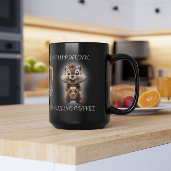 The "My Spirit Animal Is a Chipmunk" coffee mug sits on a kitchen counter with fruits and a juice glass in the background.