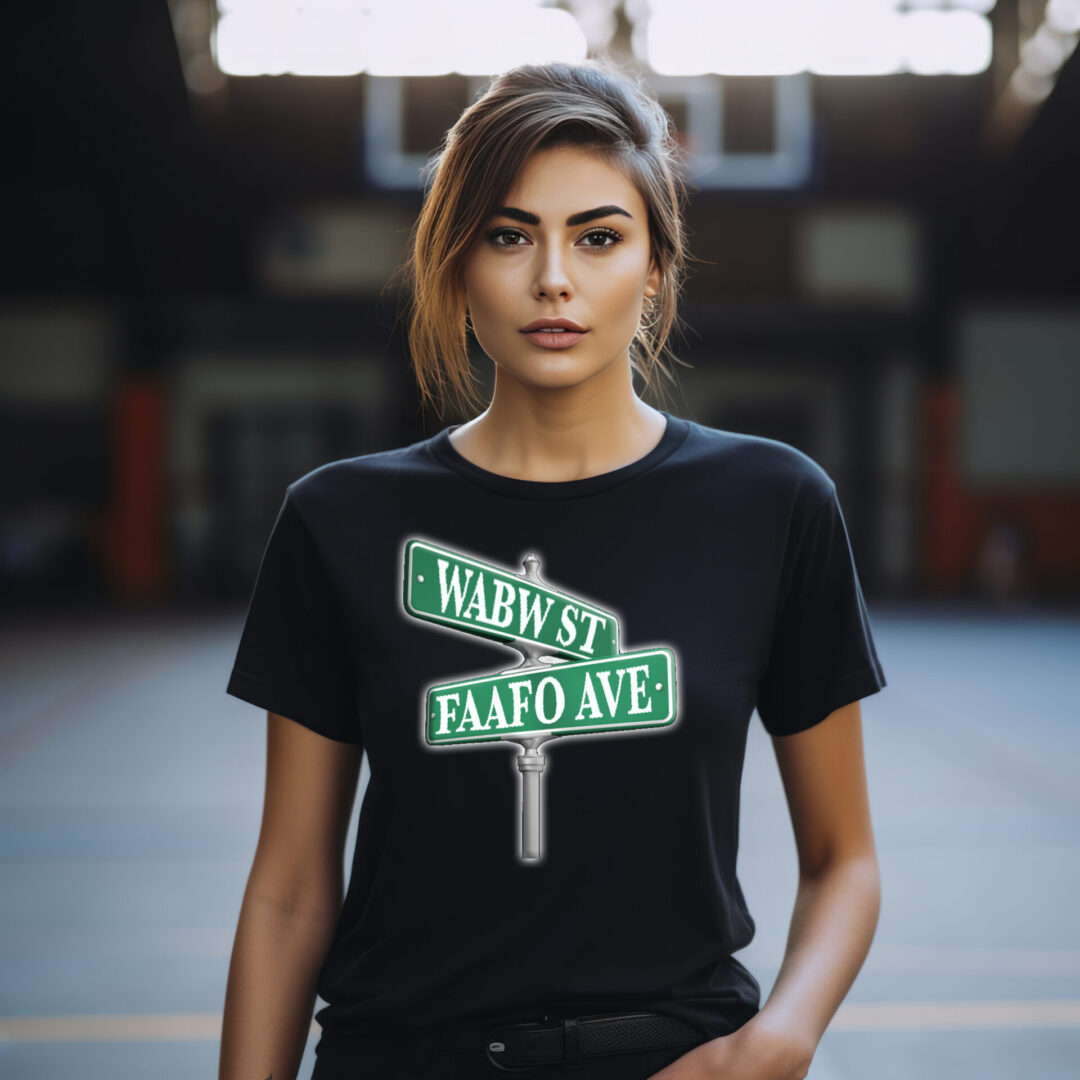 A person in a Street Sign T-Shirt with "WABW ST" and "FAAFO AVE" designs is standing on a basketball court.