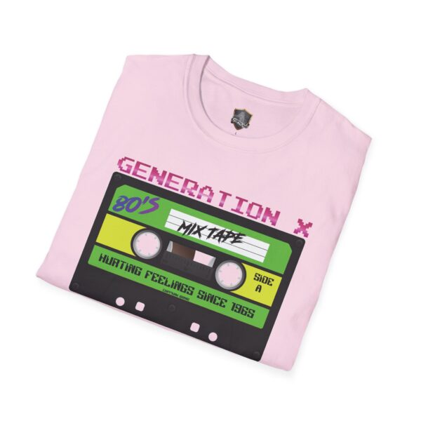 Pink T-shirt featuring a vibrant cassette tape graphic labeled "80's Mix Tape" and "Generation X." Text says "Hurting Feelings Since 1985." Product Name: Generation X Tape T-Shirt.